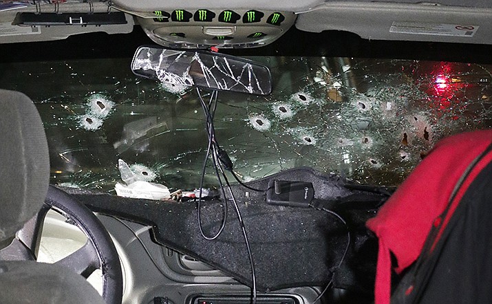 A crime-scene photo shows the bullet-riddled windshield of suspect Warren Jose’s Chevrolet Trailblazer. Police investigators said that Jose fired an assault rifle through the windshield from the front passenger’s seat. (Crime scene photo: Phoenix Police Department)