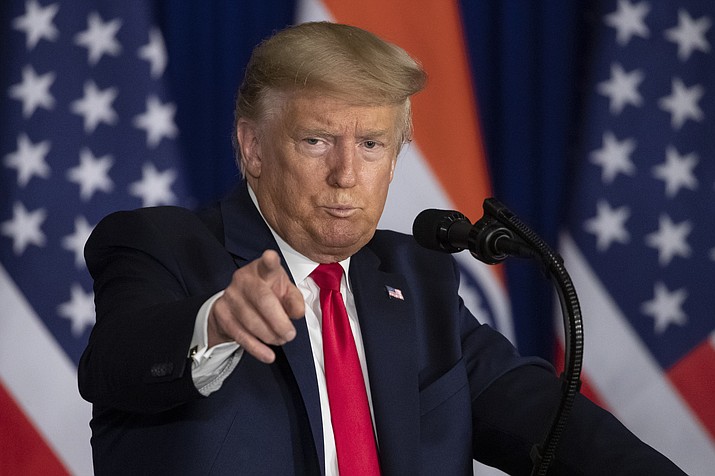 U.S.President Donald Trump points to someone asking a question during a news conference, Tuesday, Feb. 25, 2020, in New Delhi, India. (Alex Brandon/AP)
