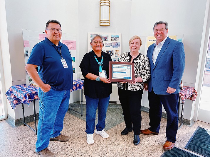 The Coconino County Elections Office received the Clearinghouse "Clearie" Award for their Native American Elections Outreach Program in February 2020. From left: Ray Daw, elections worker; Alta Edison, outreach coordinator; Christy McCormick, elections assistance commissioner and Donald Palmer, elections assistance commissioner. (Submitted photo)