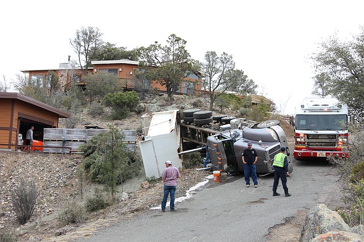 A dump truck lies on its side after rolling on Highlander Place in Prescott Friday, Feb. 28, 2020. (Max Efrein/Courier)