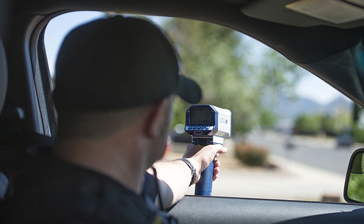 Prescott Valley Police officer Jake Lichlyter checks speeders on Robert Road in Prescott Valley on Friday, June 7, 2019. (Les Stukenberg/Courier file)