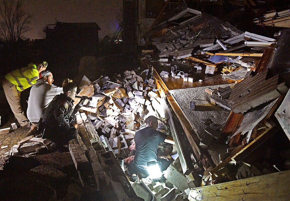 Rescue workers work to free Bill and Shirley Wallace from their home that collapsed and trappedthem under rubble after a tornado hit Mt. Juliet, Tenn., Tuesday, March 3 2020. (Larry McCormack/The Tennessean via AP)
