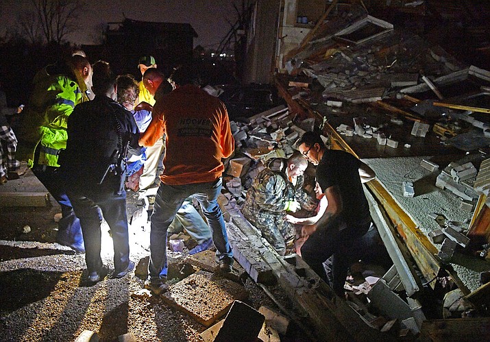 Rescue workers free Bill and Shirley Wallace from their home that collapsed, trapping them under rubble after a tornado hit area Tuesday, March 3 2020, in Mt. Juliet, Tenn. (Larry McCormack/The Tennessean via AP)