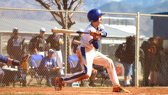 Kingman’s Cam Haller swings at a pitch during the opening day of the Kingman Invitational. Haller and the Bulldogs went 1-1 in pool play and continue action at 11 a.m. Friday against San Luis. (Photo by Beau Bearden/Kingman Miner)