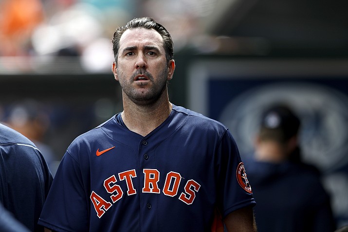 Houston Astros pitcher Justin Verlander walks in the dugout after pitching to the St. Louis Cardinals in the first inning of a spring training baseball game, Tuesday, March 3, 2020, in Jupiter, Fla. (Julio Cortez/AP)
