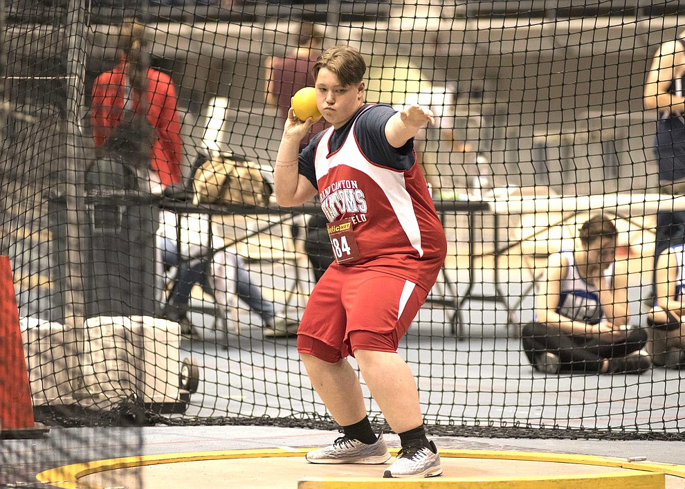 Sophomore Austin Norris-Woods gets down into a stance to throw the shot put. (V. Ronnie Tierney/WGCN)