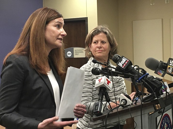 Dr. Rebecca Sunenshine, of Maricopa County Department of Public Health, left, and Dr. Shauna McIsaac, of Pinal County Department of Public Health, speak at a news conference in Phoenix on Friday, March 6, 2020. (Terry Tang/AP)