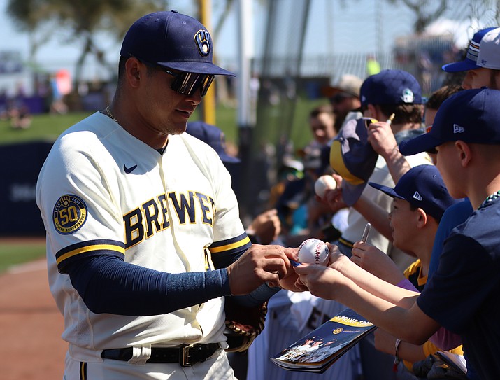 Spring training was one of the ways fans could interact with players, as Milwaukee Brewers outfielder Avisail Garcia is doing at American Family Fields of Phoenix. (Photo by Reno Del Toro/Cronkite News)