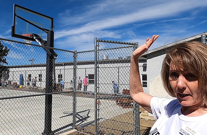 United Way of Yavapai County Executive Director Annette Olson talks about the new backboard volunteers put in for the basketball court at the Prescott Boys & Girls Club on Friday, March 6, 2020. (Jesse Bertel/Courier)