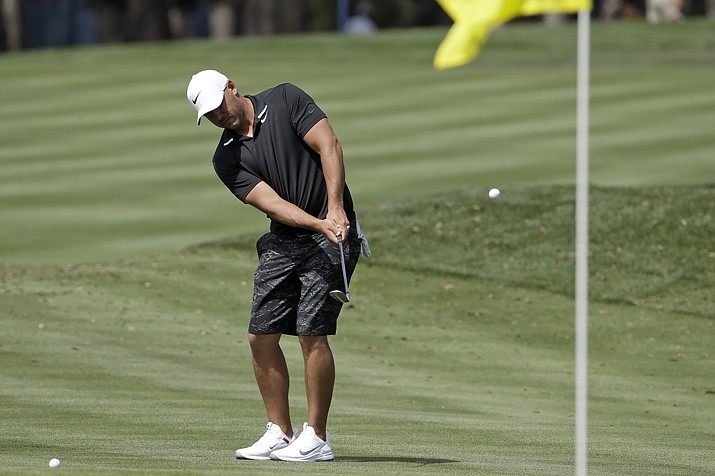 Brooks Koepka hits to the 16th green during a practice round for The Players Championship golf tournament Wednesday, March 11, 2020, in Ponte Vedra Beach, Fla. (Chris O'Meara/AP)