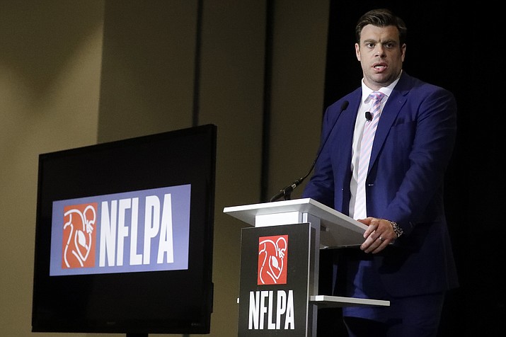 In a Thursday, Jan. 30, 2020 file photo, Eric Winston, president of the NFL Players Association, speaks at the annual state of the NFLPA press conference, in Miami Beach, Fla. NFL players have approved a new labor agreement with the league that features a 17-game regular season, higher salaries, increased roster sizes and larger pensions for current and former players. (Chris Carlson, AP File)