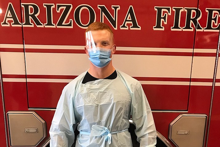Central Arizona Fire and Medical Authority (CAFMA) firefighter Zach Ducharme wears the personal protective equipment recommended for when dealing with a potentially contagious patient. (CAFMA/Courtesy)