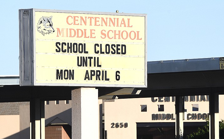 The marquee at Centennial Middle School tells the story early March 16 the first day all schools in Arizona were ordered closed for two weeks by Gov. Doug Ducey due to the coronavirus outbreak. Centennial and other Yuma schools will be closed for three weeks - two weeks mandatory with the third week being spring break for Yuma schools. (Randy Hoeft/Yuma Sun via AP)