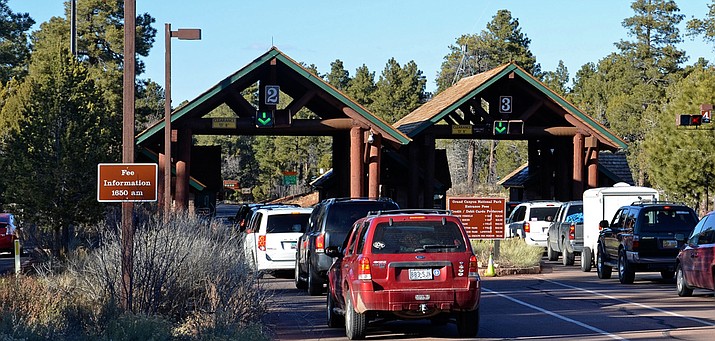 Cars line up to enter at the south entrance to the Grand Canyon in this 2018 file photo. Service at the park have been cut in response to the coronavirus, but the park remains open and the Interior Department this week waived entrance fees to all national parks. (Photo courtesy Grand Canyon National Park)