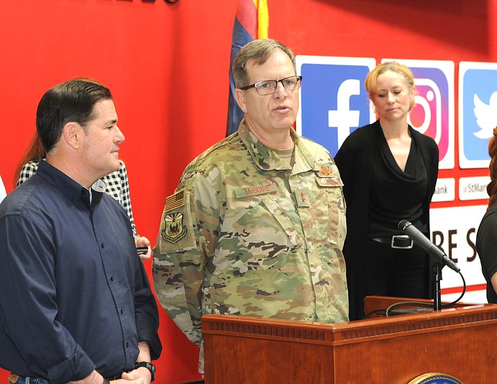 Maj. Gen. Michael McGuire, Friday, with Gov. Doug Ducey and Health Director Cara Christ, saying that National Guard troops would be used largely to help deliver groceries to supermarkets. (Howard Fischer/Capitol Media Services)