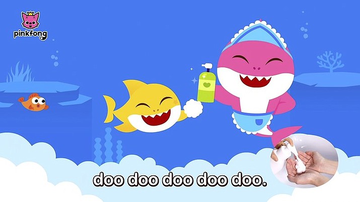 This image released by Pinkfong shows. scene from the modified "Baby Shark" video, reworked to teach kids good hygiene to combat COVID-19. The company has debuted the "Wash Your Hands With Baby Shark" video and now has started a dance challenge to encourage families to upload videos of their children washing hands to the song. (Pinkfong via AP)