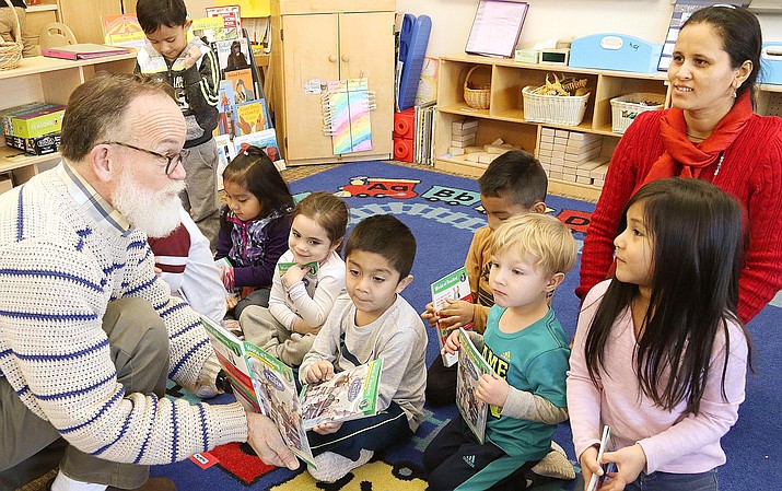 Creed Ostler reads to children at Sedona Head Start. Each month, Verde Valley First Books distributes free books each month through schools, preschools and Head Start programs. As of March 23, Verde Valley First Books will distribute age-appropriate books to children in the Cottonwood-Oak Creek, Sedona-Oak Creek, Camp Verde and Beaver Creek school districts while they are out of school. Photo courtesy Larry Kane, Arizona Community Foundation of Sedona