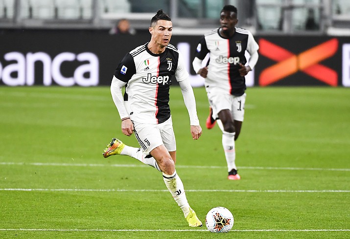Juventus' Cristiano Ronaldo controls the ball during the Serie A match between Inter Milan and Juventus at the Allianz Stadium in Turin, Italy, Sunday March 8, 2020. The match was played to a closed stadium as a measure against coronavirus contagion. (Marco Alpozzi/LaPresse via AP)