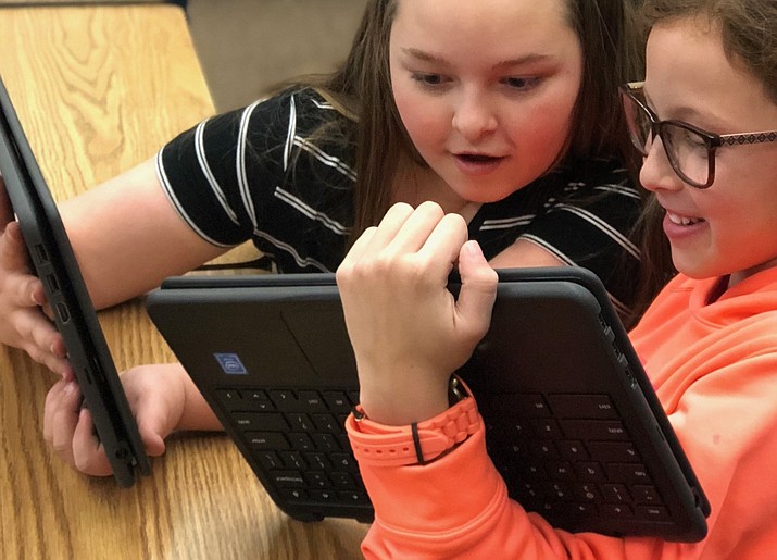 In this file image, students try out their new Chromebooks. (Courier, file)