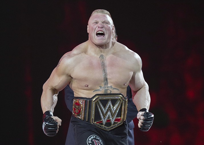 In this March 29, 2015, file photo, Brock Lesnar makes his entrance at Wrestlemania XXXI in Santa Clara, Calif. While real sports have shut down in the wake of the coronavirus pandemic, WWE has pressed on and is set to run this weekend its first WrestleMania in an empty arena. WWE stood firm that the show must go on and largely moved a card highlighted by stars Brock Lesnar and John Cena to its performance center in Orlando, Florida. (Don Feria/AP, file)