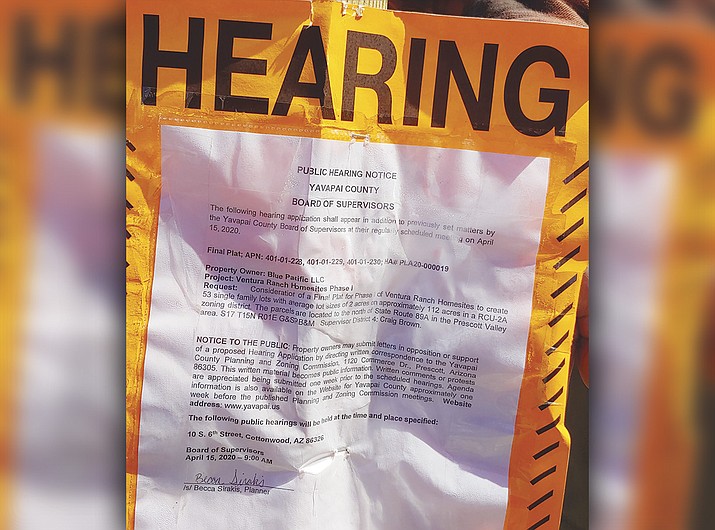 A public notice sign posted next to the new post-office boxes off of North Coyote Springs Road advertise the Notice of Hearing for a new subdivision on 112 acres near Coyote Springs. (Jesse Bertel/Tribune)