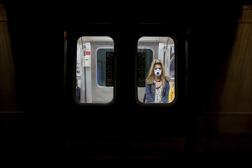 A commuter, wearing a mask as a preventive measure against the spread of the coronavirus, travels on a metro train in Istanbul, Friday, April 10, 2020.The new coronavirus causes mild or moderate symptoms for most people, but for some, especially older adults and people with existing health problems, it can cause more severe illness or death.(AP Photo/Emrah Gurel)