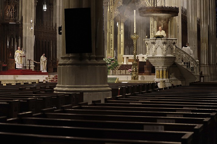 Easter Mass is conducted without congregants at St. Patrick's Cathedral in New York, Sunday, April 12, 2020. Due to coronavirus concerns, no congregants were allowed to attend the Mass but it was broadcast live on a local TV station. (Seth Wenig/AP)