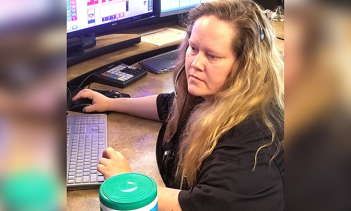 Jennifer Noss looks over a screen at the Cottonwood Public Safety Communications Center. As we observe National Public Safety Telecommunicators Week, we look at how the role of the emergency dispatcher is more critical than ever during the COVID-19 pandemic. Courtesy of Cottonwood PD