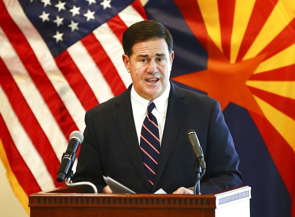Arizona Gov. Doug Ducey gives an update on the COVID-19 pandemic response Tuesday, April 14, 2020 during a press conference at the Arizona Commerce Authority in Phoenix. (Rob Schumacher/The Arizona Republic via AP, Pool)
