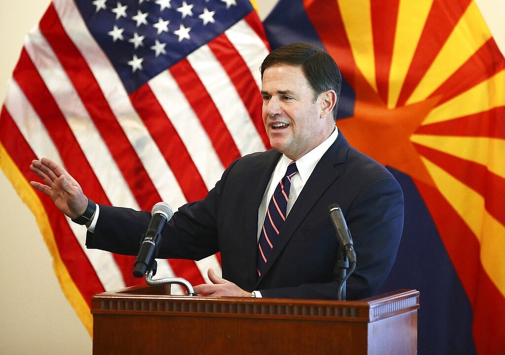 Arizona Gov. Doug Ducey gives an update on the COVID-19 pandemic response Tuesday, April 14, 2020 during a press conference at the Arizona Commerce Authority in Phoenix. (Rob Schumacher/The Arizona Republic via AP, Pool)