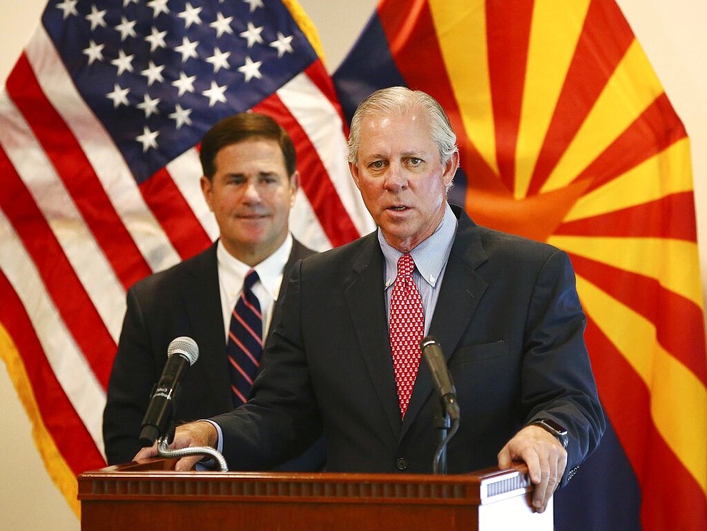 Dr. Robert C. Robbins, president of the University of Arizona, and Arizona Gov. Doug Ducey give an update on the COVID-19 pandemic response Tuesday, April 14, 2020 during a press conference at the Arizona Commerce Authority in Phoenix. (Rob Schumacher/The Arizona Republic via AP, Pool)