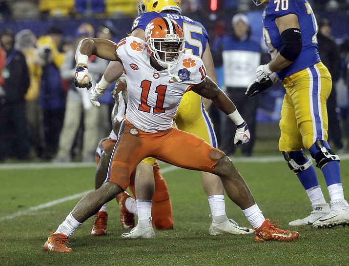 In this Dec. 1, 2018 photo, Clemson's Isaiah Simmons (11) reacts after making a play against Pittsburgh in the first half of the Atlantic Coast Conference championship NCAA college football game in Charlotte, N.C. Simmons was chosen by the Arizona Cardinals with the eighth pick in the NFL draft Thursday, April 23, 2020. (Chuck Burton/AP, File)