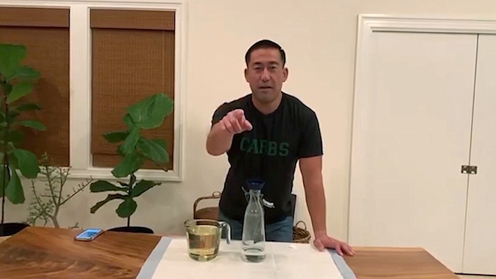 In this April 11, 2020 image from video, Kauai Mayor Derek Karakami introduces his latest "Stay Home, Kauai" video aimed at keeping his county informed and entertained after implementing a curfew to help curb the spread of coronavirus. (Derek Kawakami via AP)