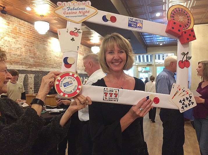 United Way of Yavapai County's outgoing executive director, Annette Olson, stands behind the casino frame in the Grand Highlands Ballroom for the campaign kick off in 2019. Olson has left the job as of May 15 for semi-retirement to her home state of Washington. (Nanci Hutson/Courier, file)
