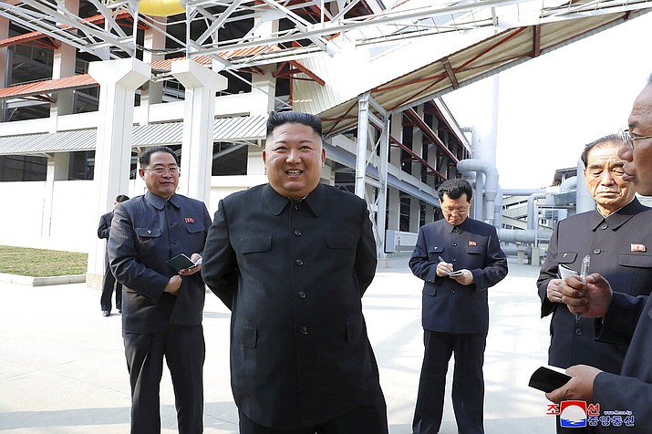 In this Friday, May 1, 2020, photo provided by the North Korean government, North Korean leader Kim Jong Un, center, visits a fertilizer factory in South Pyongan, near Pyongyang, North Korea. Kim made his first public appearance in 20 days as he celebrated the completion of the fertilizer factory, state media said Saturday, May 2, 2020, ending an absence that had triggered global rumors that he may be seriously ill. Independent journalists were not given access to cover the event depicted in this image distributed by the North Korean government. The content of this image is as provided and cannot be independently verified. Korean language watermark on image as provided by source reads: "KCNA" which is the abbreviation for Korean Central News Agency. (Korean Central News Agency/Korea News Service via AP)