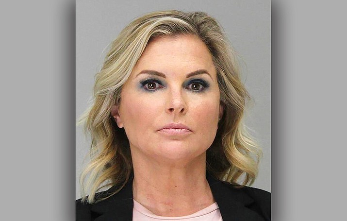 This Tuesday, May 5, 2020 booking photo provided by the Dallas County Sheriff's Office shows Shelly Luther. Luther was ordered to spend a week in jail after she continued to operate her business despite being issued a citation last month for keeping open her Dallas salon due to restrictions put in place because of the coronavirus pandemic. Luther's hearing occurred as Texas Gov. Greg Abbott relaxed more restrictions statewide, allowing barbershops and hair salons to reopen Friday. (Dallas County Sheriff's Office via AP)