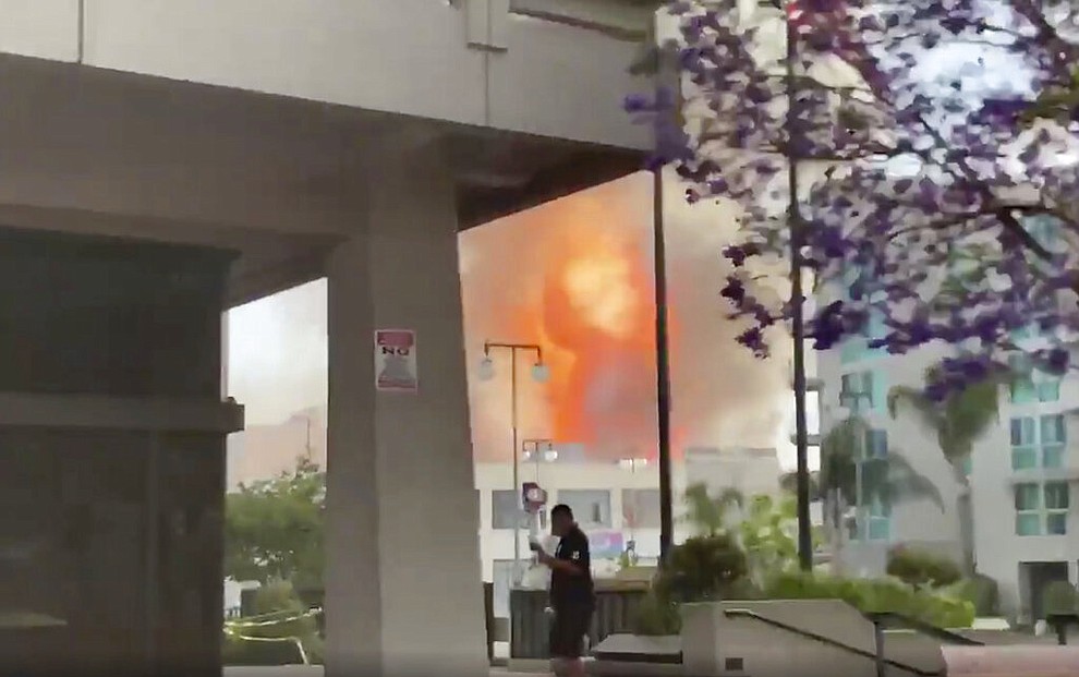 In this screen grab from video provided by Sean Miura, flames from an explosion are seen Saturday, May 16, 2020, in Los Angeles. (Sean Miura via AP)