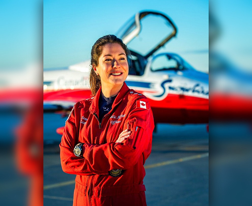 In this undated photo provided by the Royal Canadian Air Force, Capt. Jennifer Casey poses for a photo. A Canadian aerobatic jet crashed into a British Columbia neighborhood Sunday, May 17, 2020, during a flyover intended to boost morale during the pandemic, killing Casey, seriously injuring another crew member and setting a house on fire.(Royal Canadian Air Force via AP)