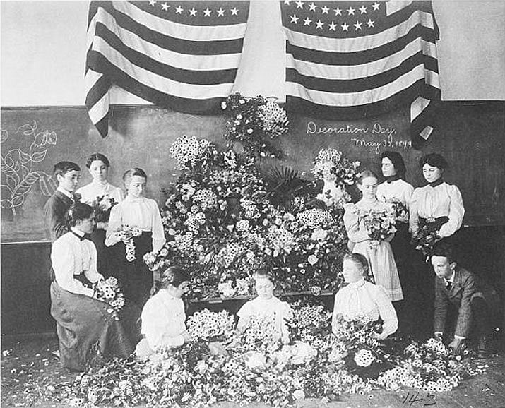 In this May 30, 1899, photograph, daisies are gathered for Decoration Day. Memorial Day was originally established as Decoration Day in 1868, three years after the Civil War ended, as a time for the nation to decorate the graves of the war dead with flowers. The day is intended to pay tribute to the individuals who have made the ultimate sacrifice in service to the United States, and their families. (Library of Congress https://www.loc.gov/pictures/resource/cph.3a07937)