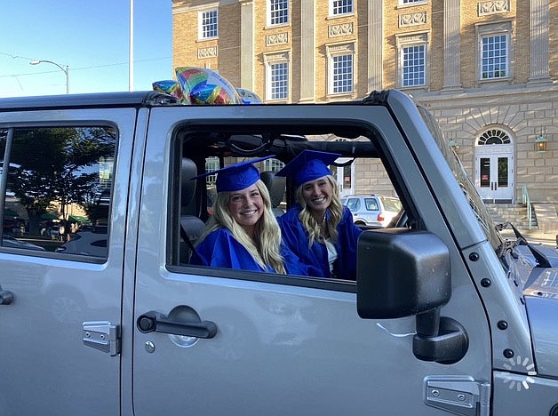 Prescott High School seniors Kendall Gisi and passenger Lily Jensen during the grad parade Thursday, May 21, 2020, in downtown Prescott. (Tyla Francis/Courtesy)