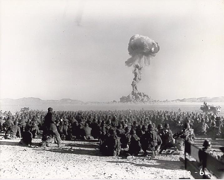 U.S. troops witness a 1951 nuclear explosion at the Nevada Test Site. Radiation from such blasts is thought to have caused high rates of cancer and other diseases among thousands of Southwestern residents called downwinders. (Photo/US Federal Govt/Public Domain)