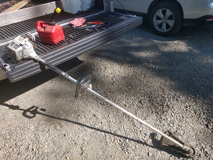 String trimmer, gas can, and tools used to maintain and replace trimming line. (Jeff Schalau, University of Arizona/Courtesy)
