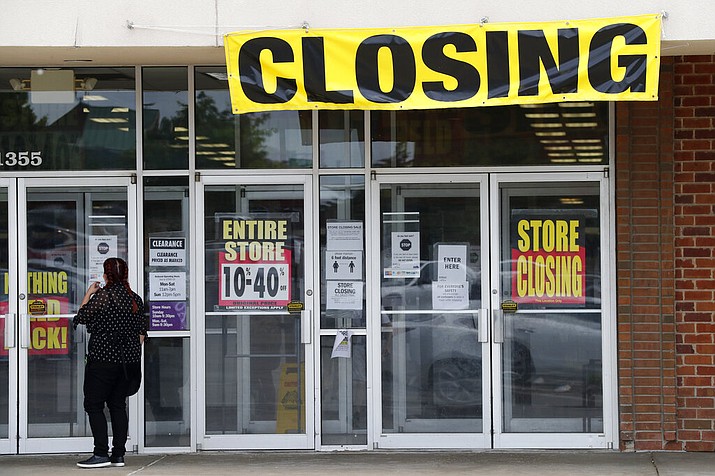 A woman walks into a closing Gordmans store, Thursday, May 28, 2020, in St. Charles, Mo. Stage Stores, which owns Gordmans, is closing all its stores and has filed for Chapter 11 bankruptcy. (AP Photo/Jeff Roberson)