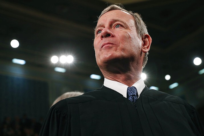 In this Tuesday, Feb. 4, 2020, file photo, Supreme Court Chief Justice John Roberts arrives before President Donald Trump delivers his State of the Union address to a joint session of Congress on Capitol Hill in Washington. A divided Supreme Court on Friday, May 29, 2020, rejected an emergency appeal by a California church that challenged state limits on attendance at worship services that have been imposed to contain the spread of the coronavirus. Over the dissent of the four more conservative justices, Roberts joined the court's four liberals in turning away a request from the South Bay United Pentecostal Church in Chula Vista, California, in the San Diego area. (Leah Millis/Pool via AP, File)