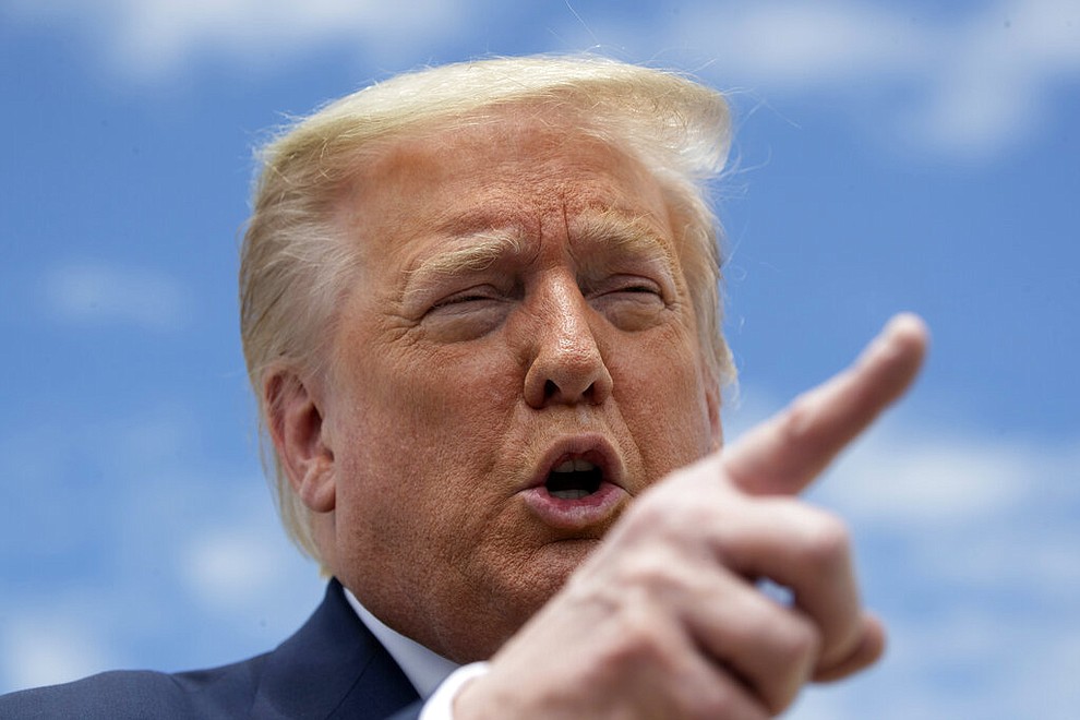 President Donald Trump speaks with reporters before boarding Air Force One as he departs Saturday, May 30, 2020, at Andrews Air Force Base, Md. Trump is en route to Kennedy Space Center for the SpaceX Falcon 9 Launch. (AP Photo/Alex Brandon)