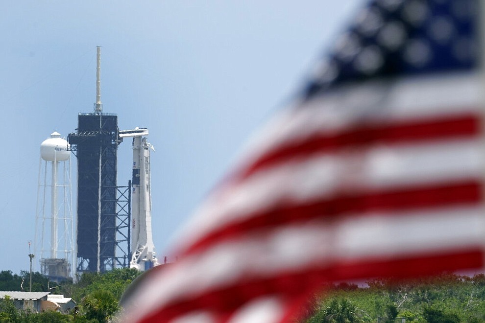 A SpaceX Falcon 9, with NASA astronauts Doug Hurley and Bob Behnken in the Crew Dragon capsule, sits on Launch Pad 39-A at the Kennedy Space Center in Cape Canaveral, Fla., Saturday, May 30, 2020. The two astronauts are on the SpaceX test flight to the International Space Station scheduled to liftoff Saturday. (AP Photo/David J. Phillip)