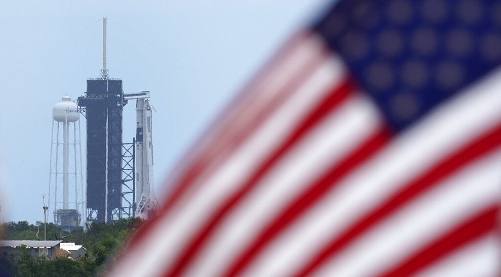 A SpaceX Falcon 9, with NASA astronauts Doug Hurley and Bob Behnken in the Crew Dragon capsule, sits on Launch Pad 39-A at the Kennedy Space Center in Cape Canaveral, Fla., Saturday, May 30, 2020. The two astronauts are on the SpaceX test flight to the International Space Station scheduled to liftoff Saturday. (AP Photo/David J. Phillip)