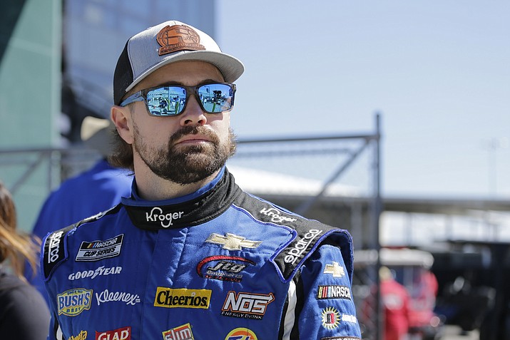 In this Feb. 9, 2020 photo, Ricky Stenhouse Jr. walks along pit road before qualifying for the NASCAR auto race at Daytona International Speedway, Su,day, in Daytona Beach, Fla. Stenhouse Jr. returned from NASCAR’s 10-week shutdown and crashed on the first lap of the first race. His next two races weren’t much better but Stenhouse finally got a break with a fourth-place finish Thursday night. Now he goes to Bristol Motor Speedway, where he has had strong runs before. The Cup Series races for the fifth time in 14 days on Sunday. (Terry Renna/AP, File)
