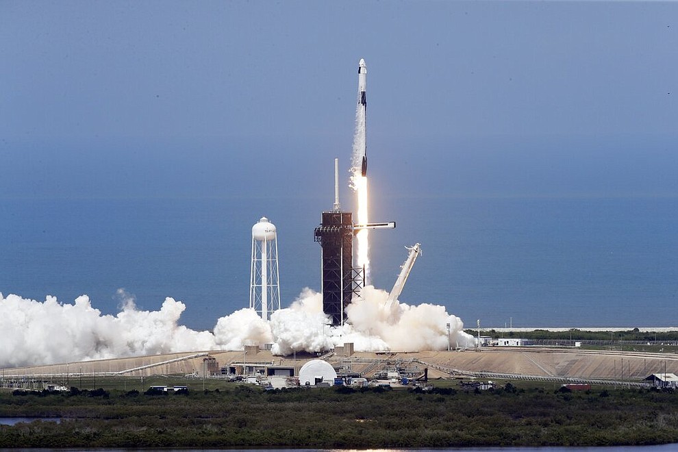 A SpaceX Falcon 9, with NASA astronauts Doug Hurley and Bob Behnken in the Dragon crew capsule, prepare to lift off as the vehicle vents fuel, from Pad 39-A at the Kennedy Space Center in Cape Canaveral, Fla., Saturday, May 30, 2020. The two astronauts are on the SpaceX test flight to the International Space Station. For the first time in nearly a decade, astronauts will blast towards orbit aboard an American rocket from American soil, a first for a private company. (AP Photo/Chris O'Meara)