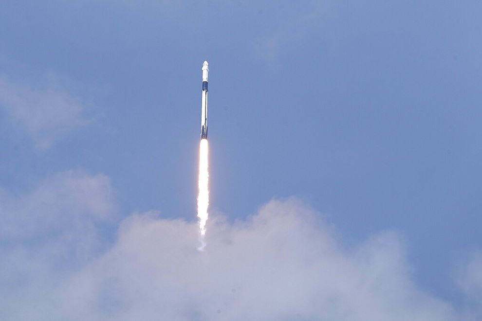 A SpaceX Falcon 9, with NASA astronauts Doug Hurley and Bob Behnken in the Dragon crew capsule, lifts off from Pad 39-A at the Kennedy Space Center in Cape Canaveral, Fla., Saturday, May 30, 2020. For the first time in nearly a decade, astronauts blasted towards orbit aboard an American rocket from American soil, a first for a private company.(AP Photo/John Raoux)